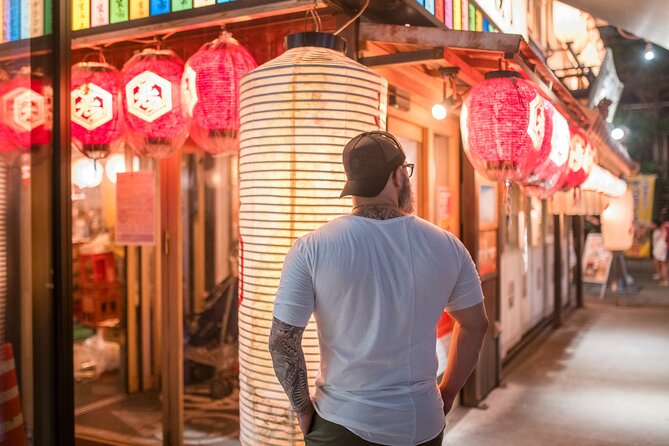 Experience Tokyo Through the Lens of a Local Artist - Kabukicho District: neon energy with controlled posing