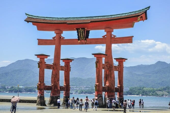 Hiroshima and Miyajima by Bike and Boat - Miyajima island exploring: streets, deer, and orange against green