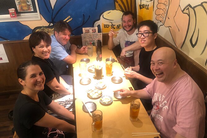 Hungry Osaka Street Food Tour:15 Tastings & 3 Drinks with a Local - The Shinsekai Walk and Tsutenkaku: Your First Taste of Local History