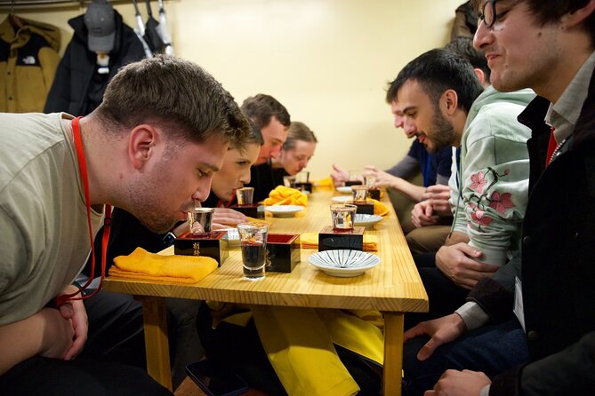 Japanese Food Experience Night Tour in Ueno - Ameyoko Shopping Street walk: people, energy, and food context
