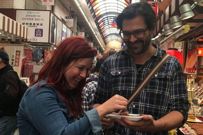 Kuromon Market Food Walking Tour in Osaka (6 stops, 6 tastes) - Namba Grand Kagetsu and the comedy-district energy