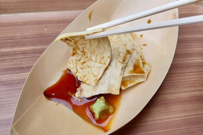 Kyoto Food Tour of 10 Tastings with Wagyu, Mochi & More Surprises - Nishiki Market: yuba tofu, sake, fish cakes, and Kyoto craft energy