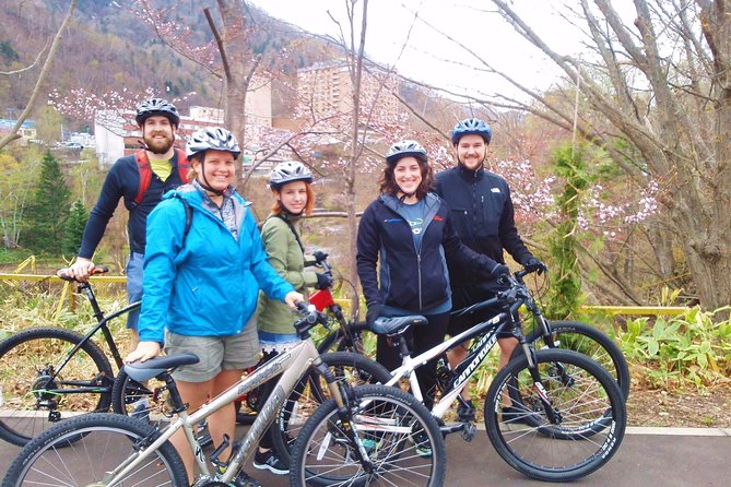 Mountain Bike Tour from Sapporo Including Hoheikyo Onsen and Lunch - Crossing into Jozankei: steam, a riverside town stop, and a snack