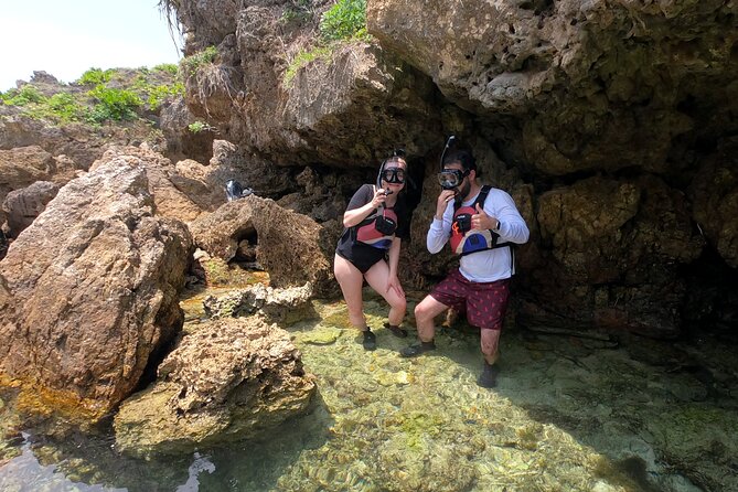 Okinawa: Kayak & Snorkel, Private Tour in Yanbaru - Stop 1 at Nakijin-son: rugged cliffs, paddling off the beaten line