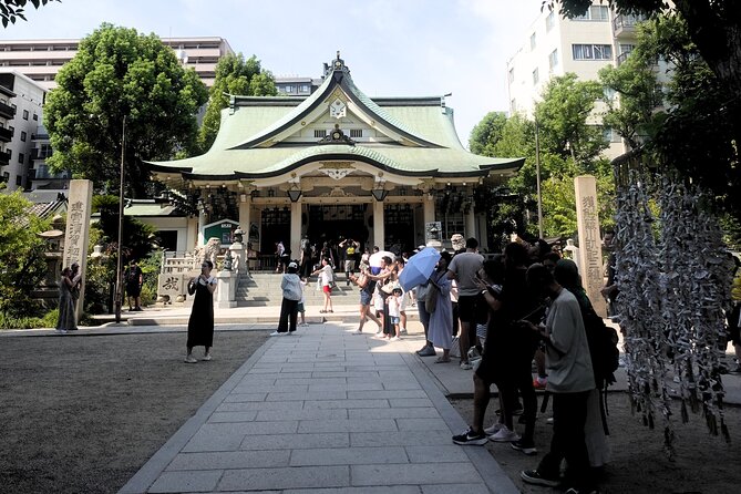 Osaka 4-Hour Walking Tour: Hotspots and Hidden Gems - Namba Yasaka Shrine and the lion that swallows bad luck