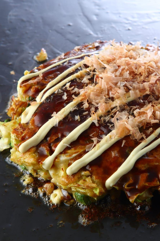 Osaka: Cooking Class & Sake Tasting with Local Market Visit - Cooking Osaka classics in a real-life studio setting