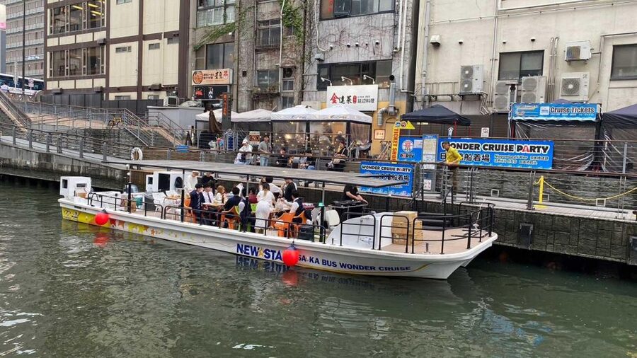 Osaka: Dotonbori District River Cruise with Drink Discount - Covered boat comfort, restroom, and weather sanity