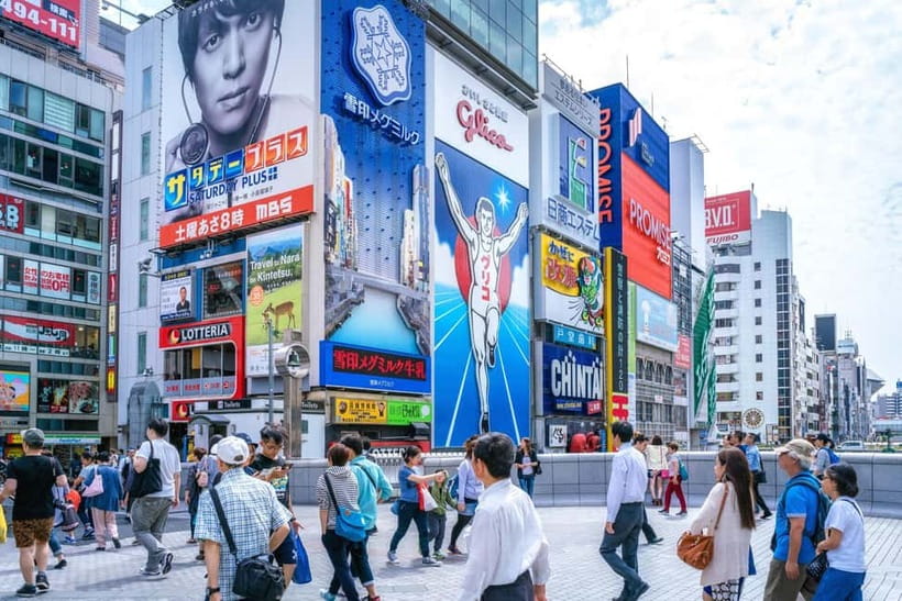Osaka: Food Tour Kuromon Market & Dotonbori with Guide - Dotonbori neon walk and Ebisu Bridge Glico photo stop