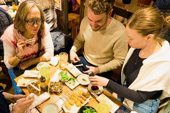 Osaka: Guided Food Tour with 12 Dishes at 4 Local Eateries - Stop by Stop: Dumplings, Takoyaki, Izakaya Energy, and the Osaka Classics