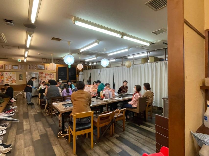 Osaka: Local Foodie Tour in Dotonbori and Shinsekai - The narrow museum-like alley and a temple pause near Namba