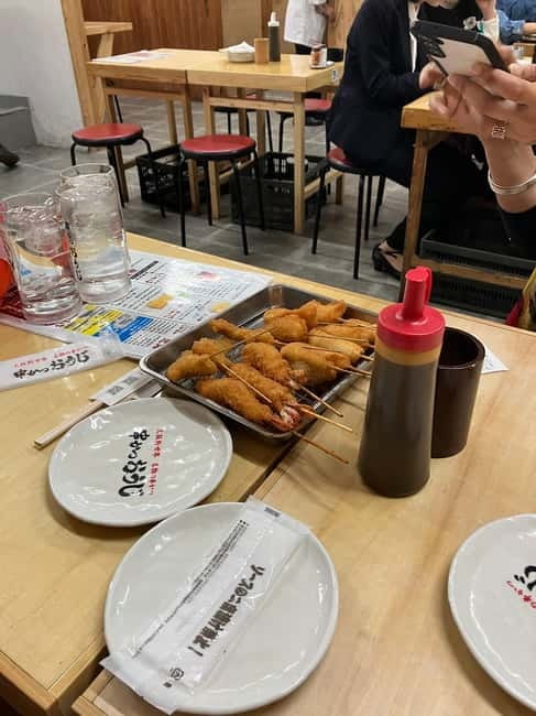 Osaka: Private and Fully Customized Tour with Hotel Meet Up - Kuromon Ichiba Market: snacks, stops, and good use of 30 minutes