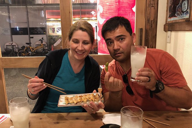 Osaka Private Food Tours by Local Foodies: 100% Personalized - Stop 2: Dotonbori canal lights and Osaka’s two big cravings
