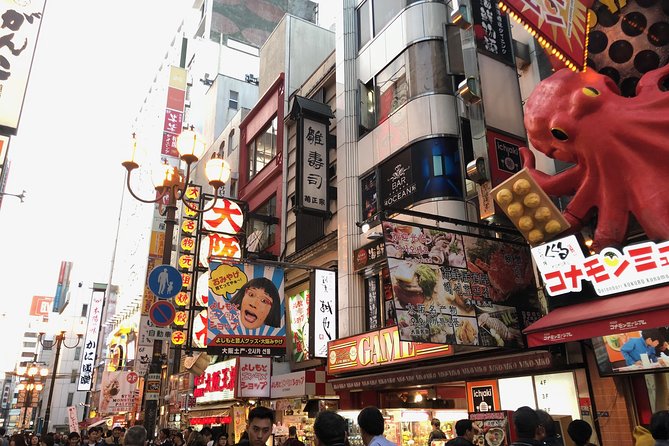 Osaka Private Pop Culture Tour: Historic Tenma to Dotonbori - Dotonbori icons: giant signs, canal views, and street-food heat