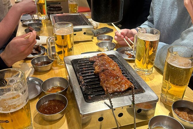 Tokyo: Shinjuku Bar Hopping & Night Walking Tour - Golden Gai: tiny doors, surprising access, and sake talk that makes sense
